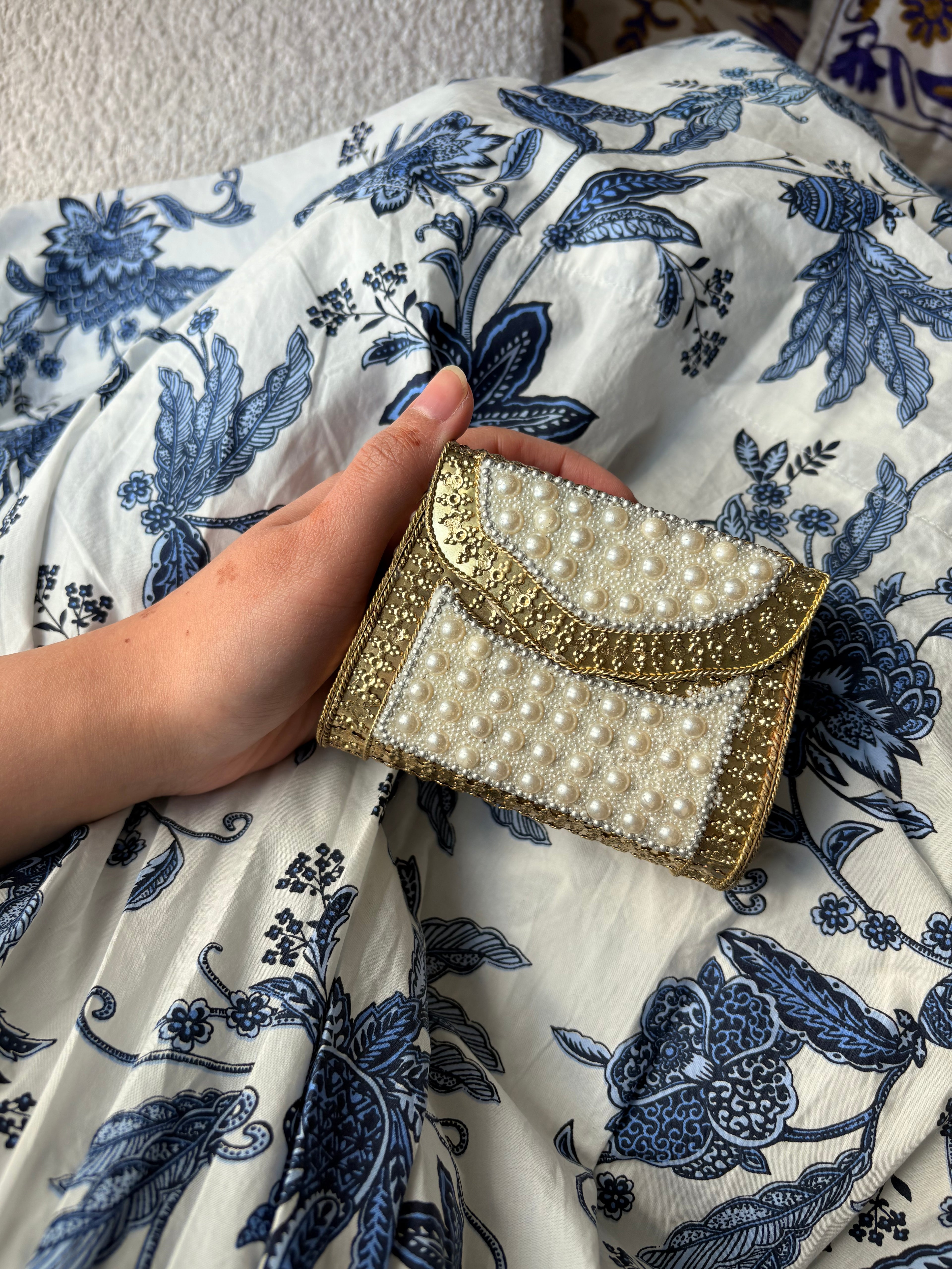 White pearl metal clutch