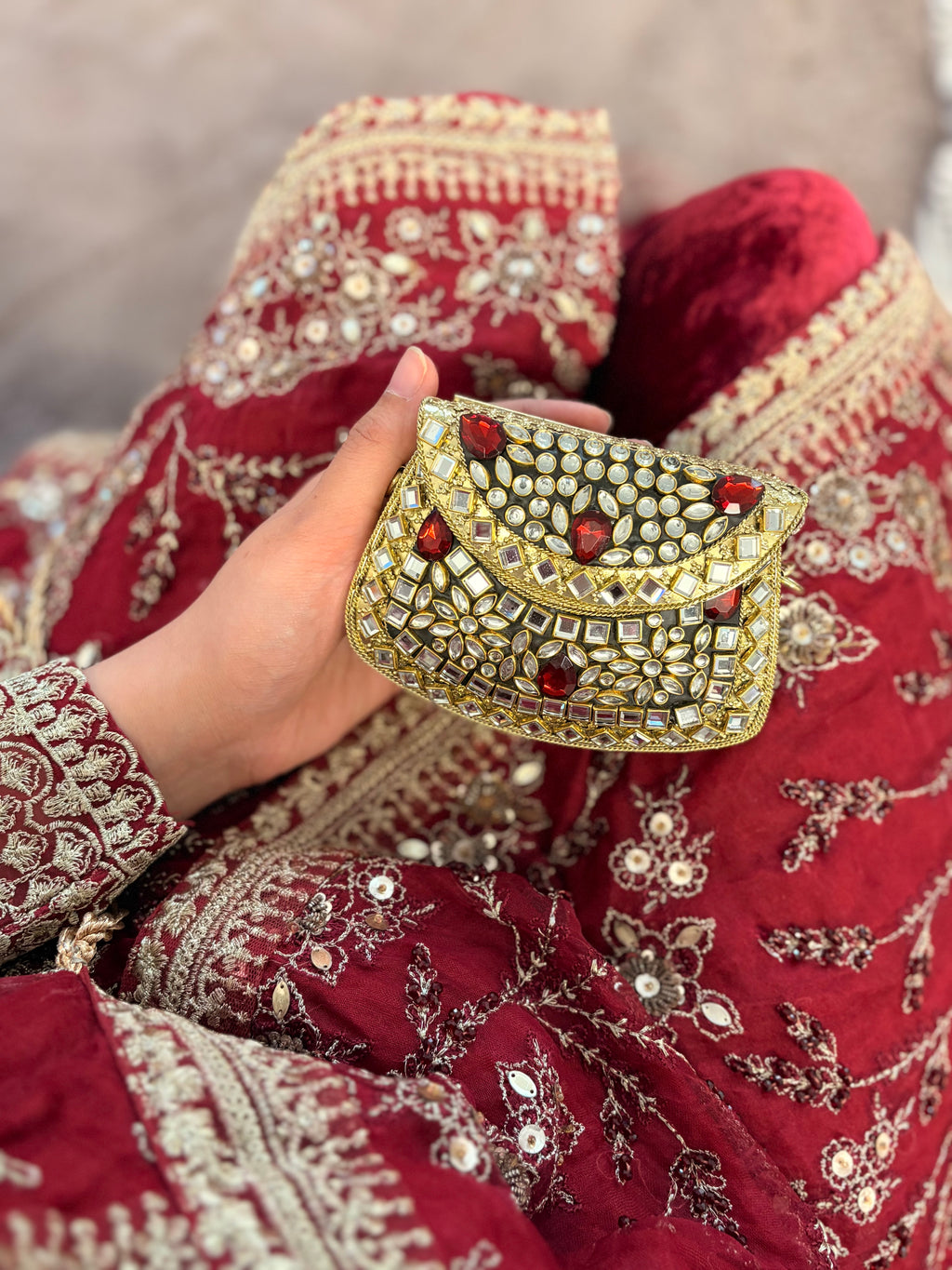 Red stone metal clutch