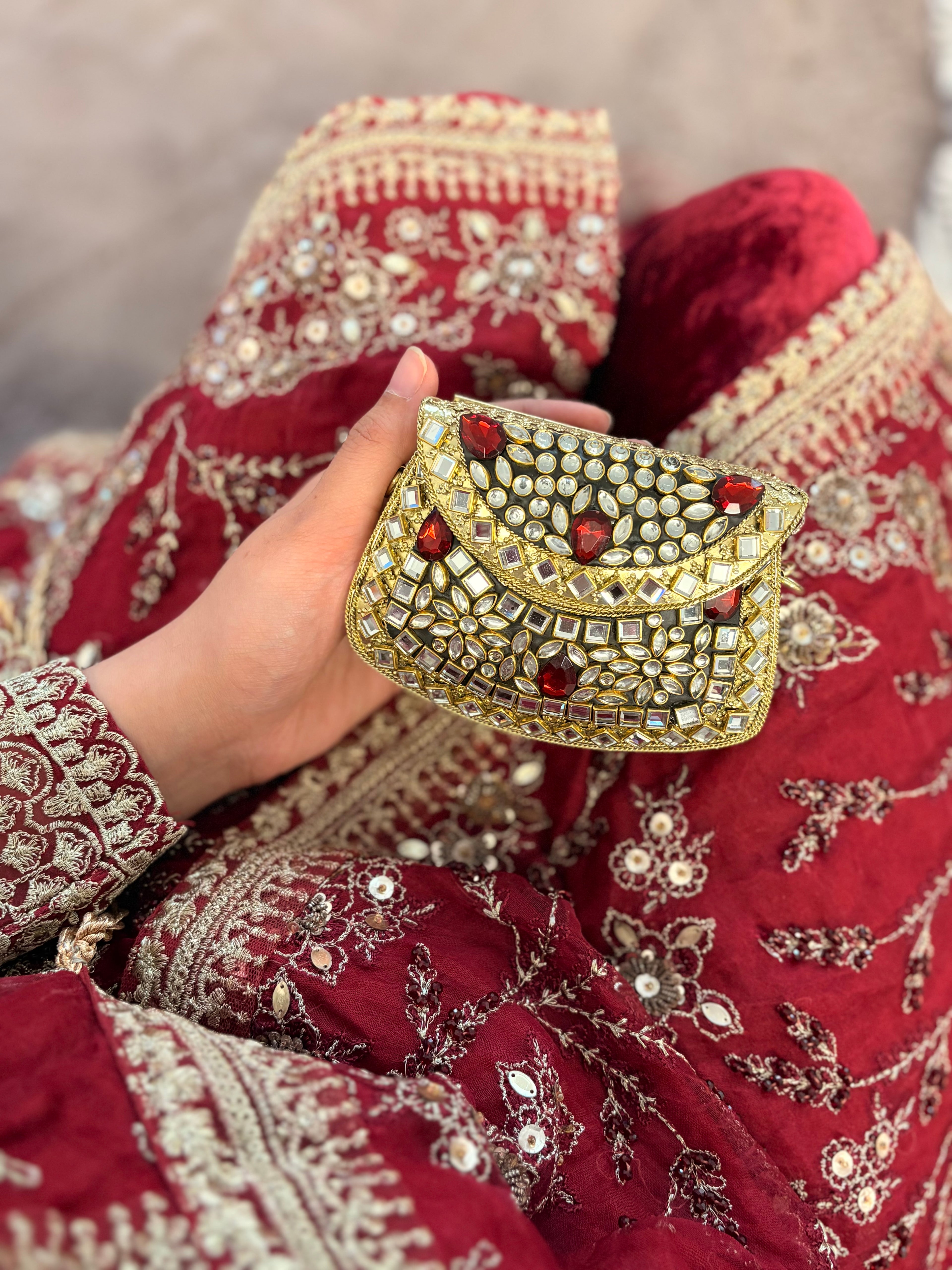 Red stone metal clutch
