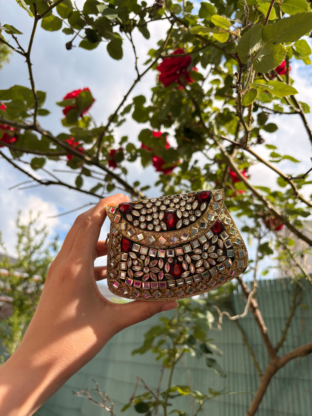 Red stone metal clutch