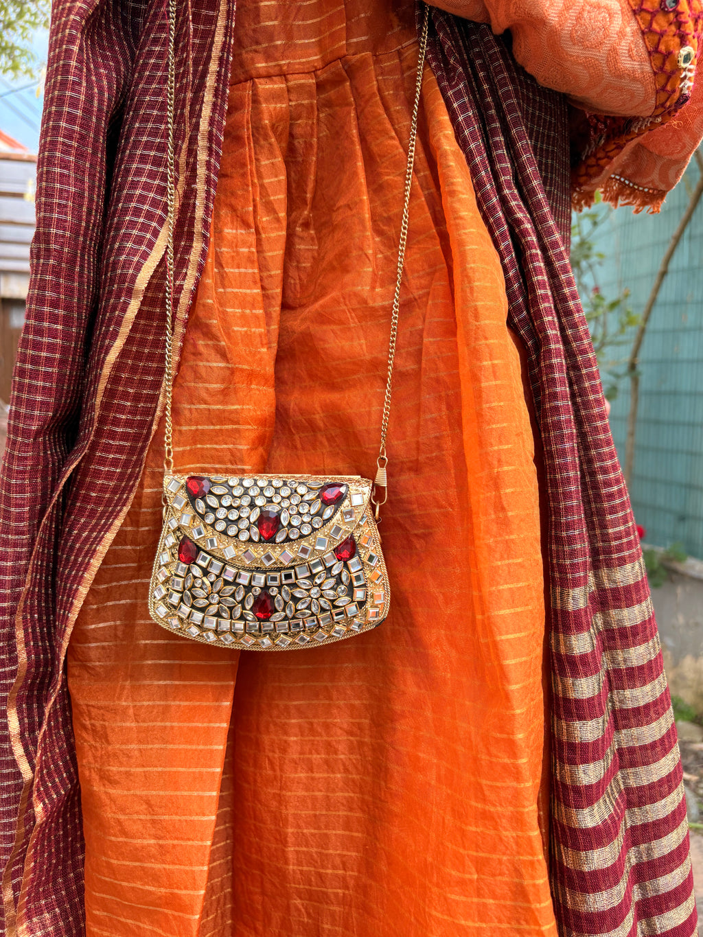 Red stone metal clutch